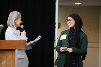 Dean Zofia Burr awarding award to a Peraton winner