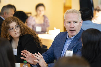 Students listen to one of the roundtable guests speak about his career